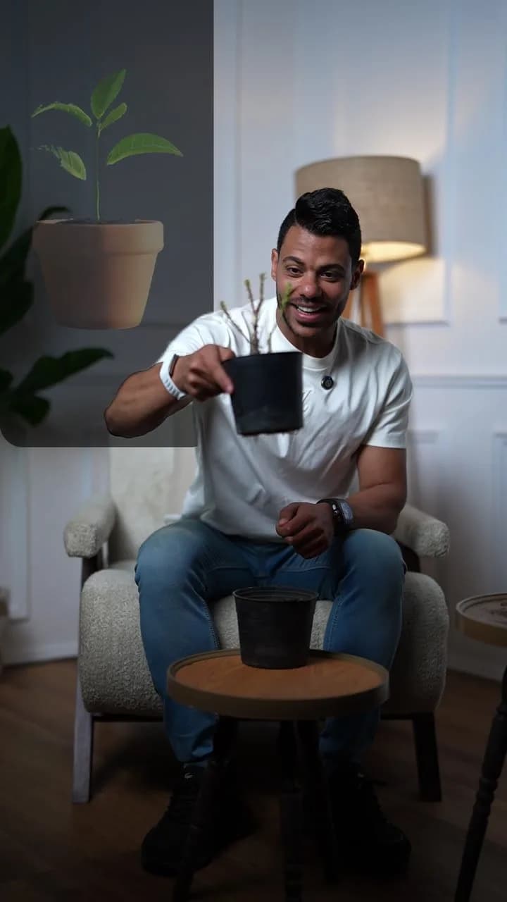 Abdelrahman Amr holding a small plant